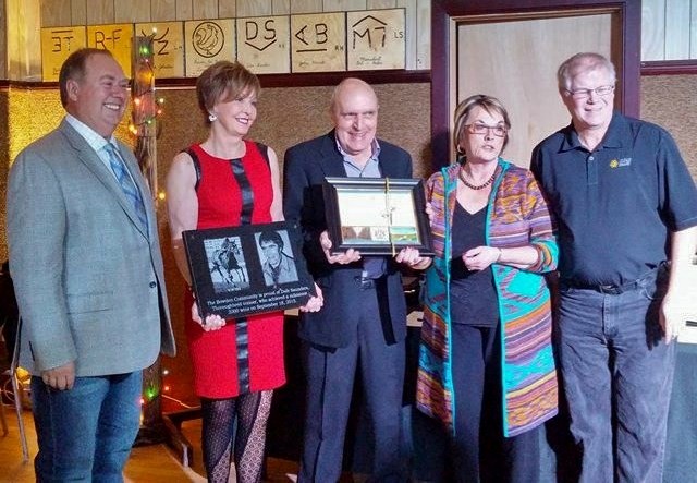 Longtime horse breeder-trainer Dale &quot;Colonel&quot; Saunders was honoured with a plaque by Bowden officials on New Year&#8217;s Eve. From left to right are Jim Wood,