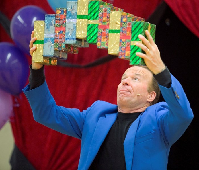 Motivational magician Steve Harmer performs for a group celebrating the 10th anniversary of the Carstairs Rainbows support program at Hugh Sutherland School.