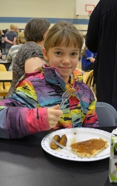 Lauren Lagacy enjoys a pancake breakfast to celebrate Shrove Tuesday at St. Marguerite Bourgeoys School on Feb. 9