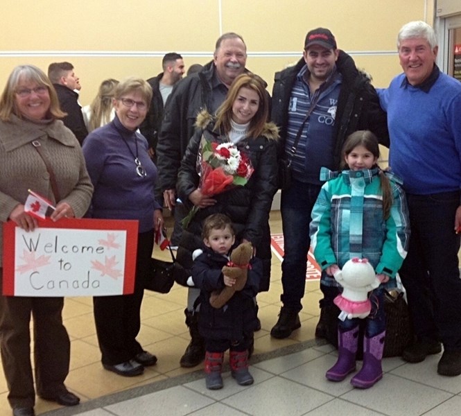 Members of the refugee committee with Our Lady of Peace Catholic Church were at Edmonton International Airport on Feb. 14 to welcome the Hohwate family from Syria. They are