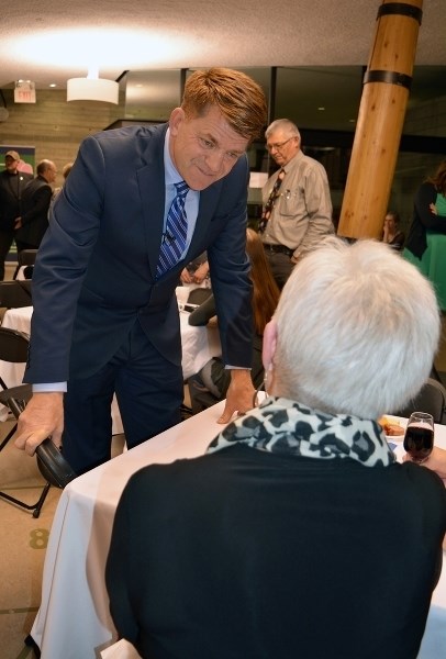 Wildrose Leader Brian Jean speaks with Mabel Hamilton, one of many local and area residents who attended a party fundraiser at the Innisfail Library/Learning Centre on Feb.