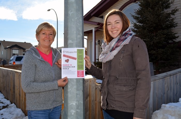 Members of the Welcoming Communities Committee Evelyn McCrackin, left, and Erin Falk are helping prepare for the group&#8217;s first fundraising event on March 19 at the