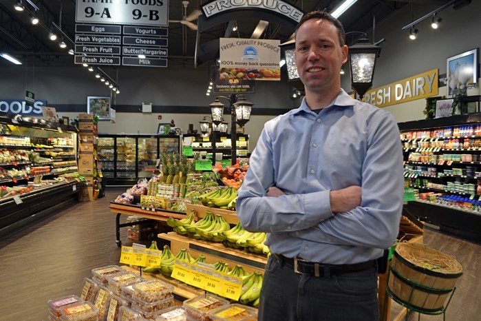 Joe Tait, one of four owners at Penhold Family Foods, in the store&#8217;s produce section. The Penhold store is the setting on March 10, from 1:30 to 3 p.m, of a healthy