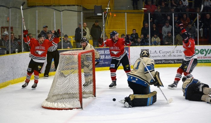 Adam Johnson, left, Fred Tanguay and Caylen Walls, right, celebrate the Eagles&#8217; second goal of the game, scored by Walls, during the second period in Game 7.