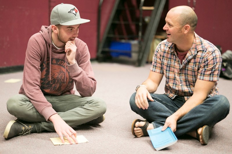 Innisfail High School teacher Rob Burton, right, speaks with Qui Hauser during a drama class last year at the school in early rehearsals for the upcoming Almost, Maine