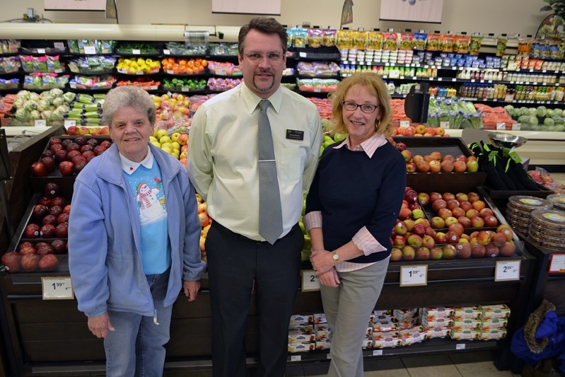 An Alberta Shares partnership. From left, Carole Sim, coordinator of the Innisfail and District Food Bank, Darren Andres, manager of Innisfail Co-op&#8217;s food centre and