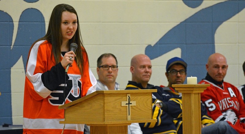 Former Innisfail Flyers hockey player Taryn Baumgardt speaks to students and the Innisfail Female Atom Flyers team during the Female Atom Provincial Championship kickoff