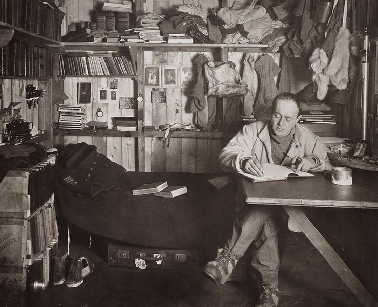 A photo of Captain Robert Falcon Scott, a British explorer, seen here writing in his journal during his expedition to the South Pole in 1911.