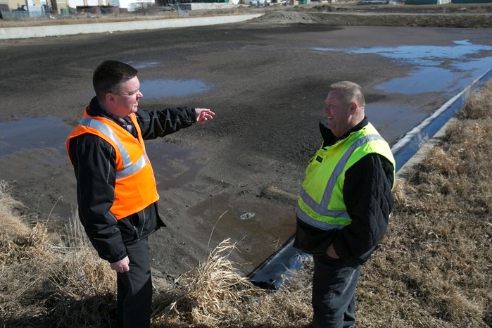 Craig Teal, the town&#8217;s director of planning and operational services (left), and Dan Gervais, public works and utilities superintendent, discuss the pending demolition