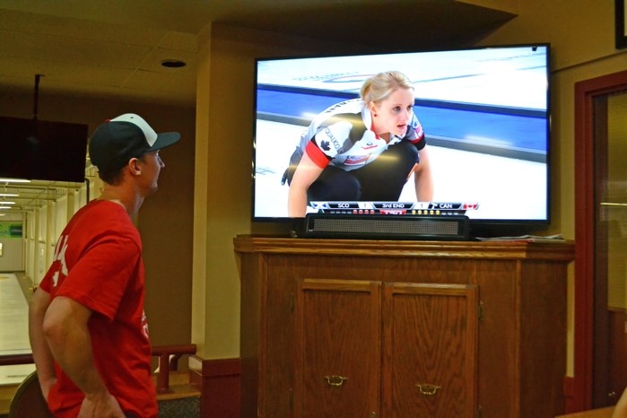 Joel Peterman, 26, a Grade 5 French Immersion teacher in Red Deer and a longtime Innisfail curler, watches his younger sister Jocelyn on national television play for Canada