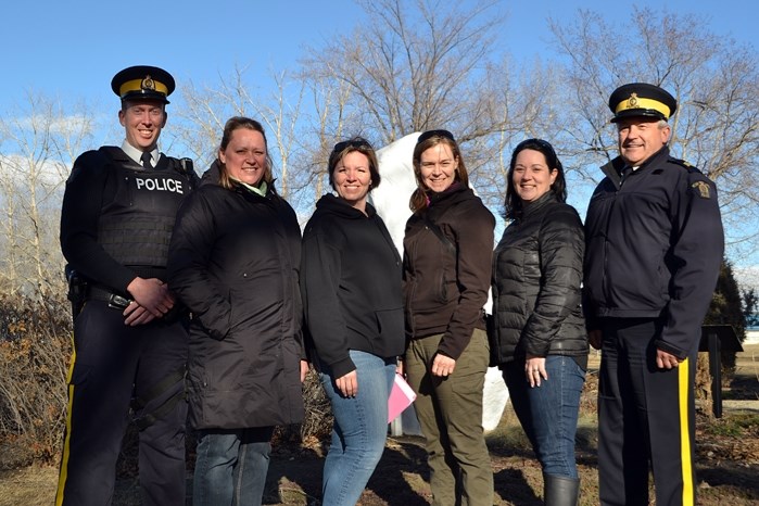 Board members of the Innisfail Urban Watch Society gather with Innisfail RCMP to celebrate its public launch for the community. From left to right is Const. Chris Lavery,