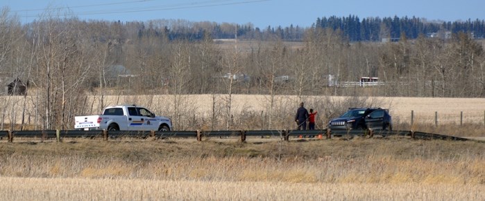 RCMP investigators look over an area where bones were discovered during the evening of April 5. RCMP cannot confirm the nature of the bones at this time. An examination of