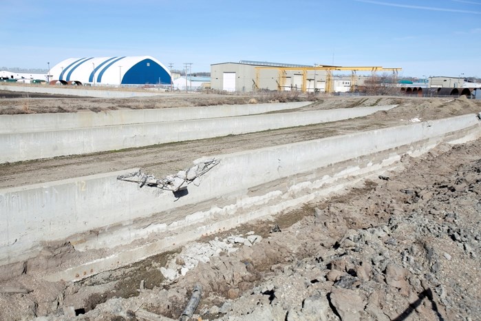 The town has awarded a $100,000 contract to a High River company to demolish the old sewage treatment plant, a project the town had originally budgeted at $1.3 million.