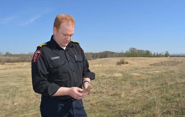 Dean Clark, Innisfail fire chief, is &quot;definitely concerned&quot; with the dry early spring conditions in and around the town, a condition that has seen many wildfires