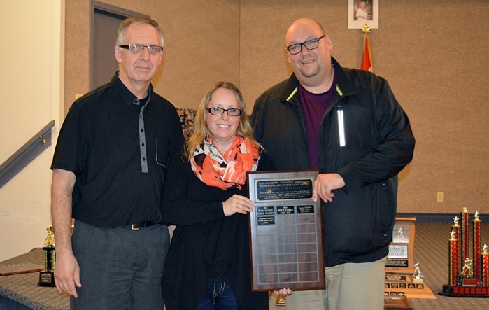 Dez Lorencz, right, is seen here with Teresa Dodd, centre, when they received the Don Poynter (Choppy) Memorial Award for Team Manager of the Year during the Innisfail Minor