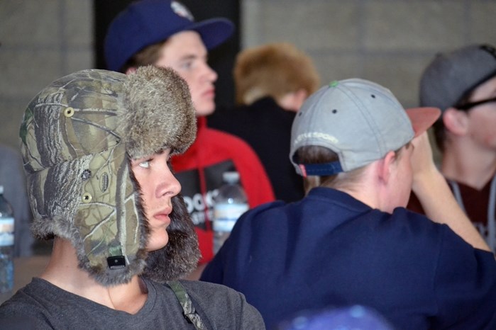 Local skateboarders listen intently to Trevor Morgan, vice-president of New Line Skateparks, who gave a 75-minute presentation at the community&#8217;s first Skatepark Design 