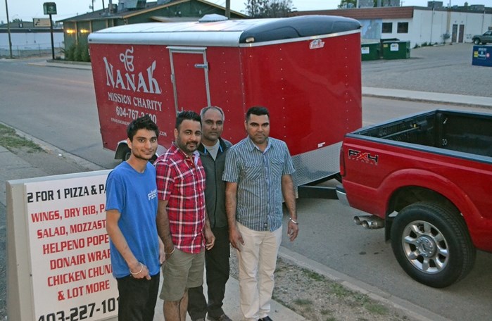 Innisfail Pizza staff, along with family members from Surrey, B.C., filled two trailers of donations for Fort McMurray families. The team delivered a total of $19,000 worth