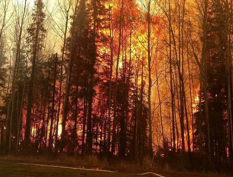 The scene along Highway 63 in the Fort McMurray area on May 16 that faced Innisfail-area firefighters. OP Fire &#038; Safety&#8217;s four firefighters were evacuated from