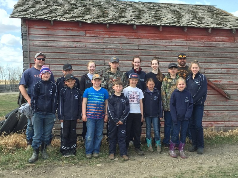 Members of the Knee Hill Valley 4-H Beef Club at its presale on April 16, a rehearsal that helps them prepare for the day of their sale. It is held every year at Garnet