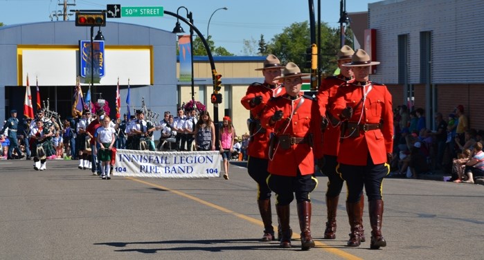 Members of the Innisfail RCMP march in unison during the Rotary Parade in Innisfail Saturday, June 18. The annual parade, attended by hundreds of Innisfailians and area