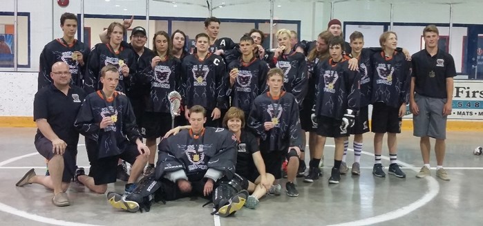 Members of the Innisfail Phantoms midget team proudly show off their gold medals they won in this year&#8217;s Spirit of the Sticks tournament.