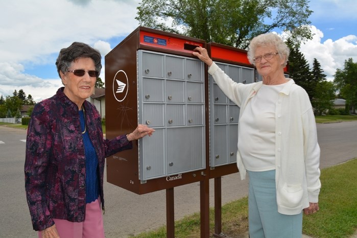 Eula Brown, left, and Helen McKenzie say while they may not be directly impacted, the looming strike or lockout by Canada Post workers July 2 will affect local residents.