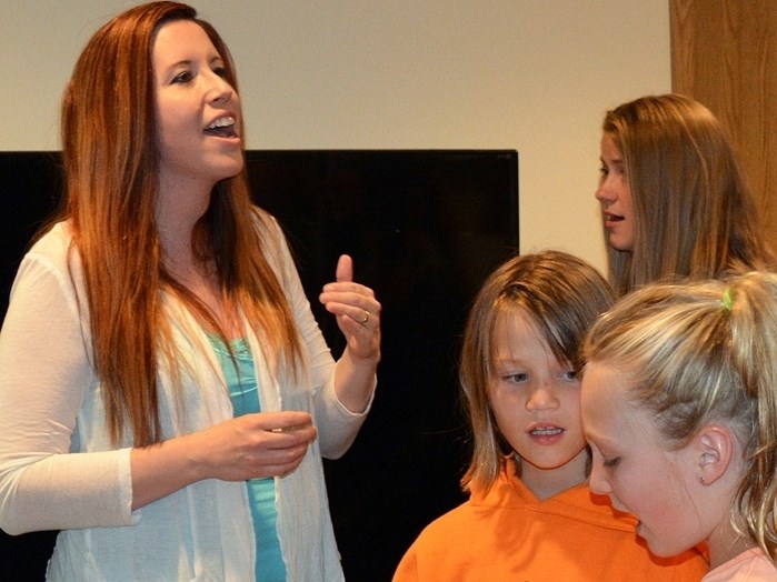 Jeanette Manser, left, rehearses with her students prior to her last year-end recital at the Innisfail United Church on June 19. The Innisfail music teacher recently retired