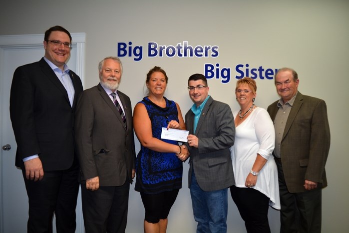 Big Brothers Big Sisters Prairies To Peaks received provincial funding on June 10 for its mentoring programs. On hand for the $55,000 cheque presentation were from left,