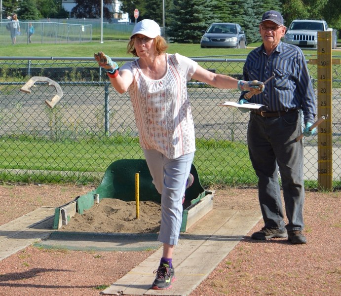 Carol Brodie, left, is one of four new members with the Innsifail Horseshoe Club. She is seen here participating in a game during a recent Wednesday league night.