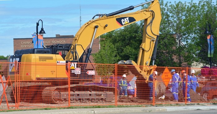 Workers at a large piece of commercial land, located at the corner of Main Street and 49th Avenue in Innisfail. The commercial property is currently undergoing an