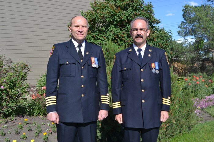 Dennis Fehr, deputy chief of the Innisfail Fire Department (left) and Tim Ainscough, the department&#8217;s assistant deputy chief of training. They both have been honoured