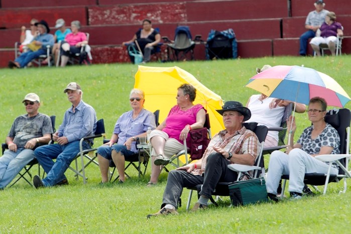 Crowds of people take in the Ivan Daines Country Music Pick-Nic at the Daines Ranch and Rodeo Grounds, north of Innisfail. This year marks the 40th annual event.