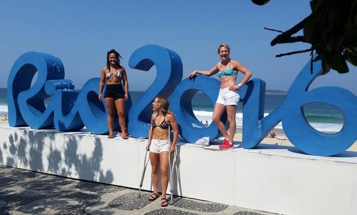 Danielle Lappage (with crutches) poses in Rio with fellow Olympians Mallory Velte and Jillian Gallays.