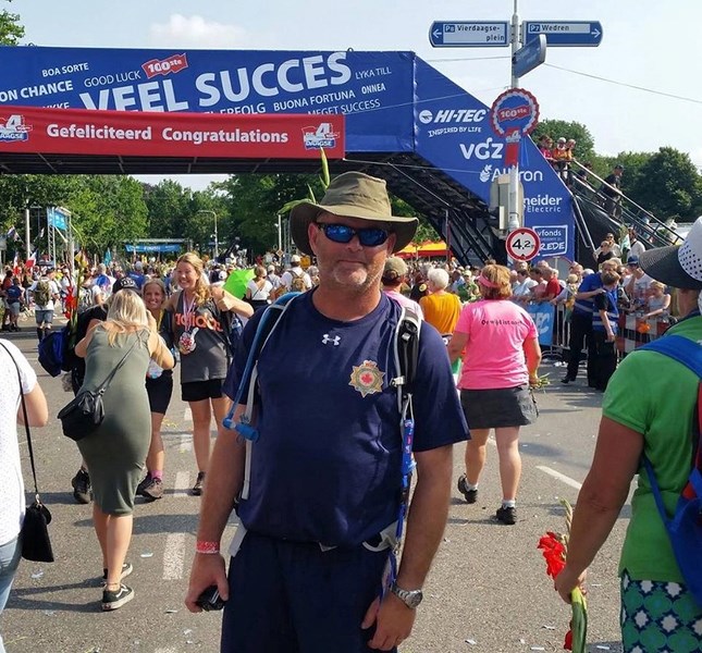 Innisfail resident Doug Holsworth stands at the finish line of the 2016 Walk of the World in Nijmegen, Holland. The 100th anniversary of the event took place this summer.