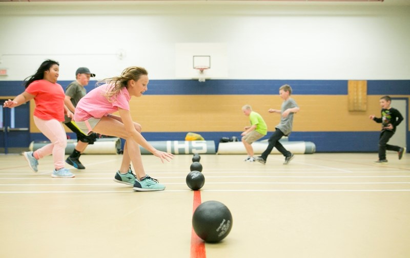 Players chase down balls at the start of one of the dodgeball games at Innisfail High School. The drop-in games started up again in recent weeks.