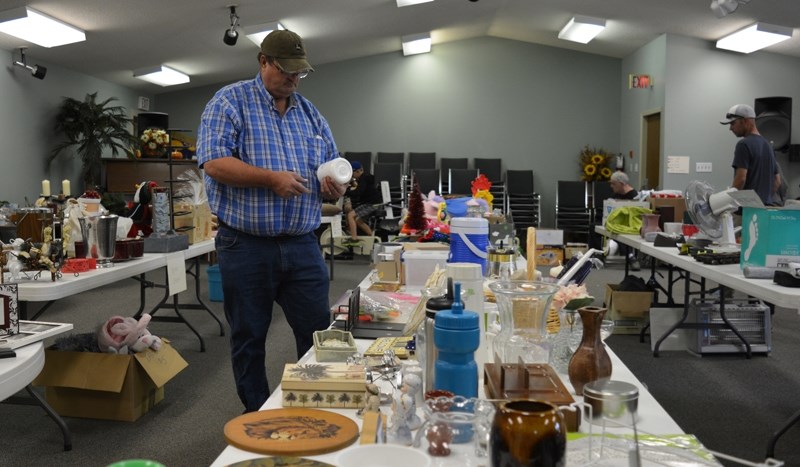 Local residents checked out some of the items for sale during the Welcoming Communities multi-family garage sale fundraiser at the Innisfail Church of the Nazarene on Sept.