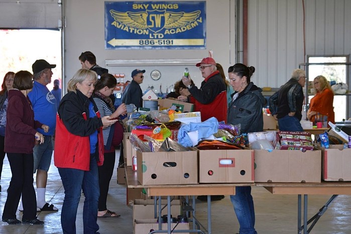 A yard sale and barbecue helped raise funds for the Red Deer Food Bank during the 2016 Operation Food Lift at the Sky Wings Aviation hangar at the Red Deer Airport on Sept.