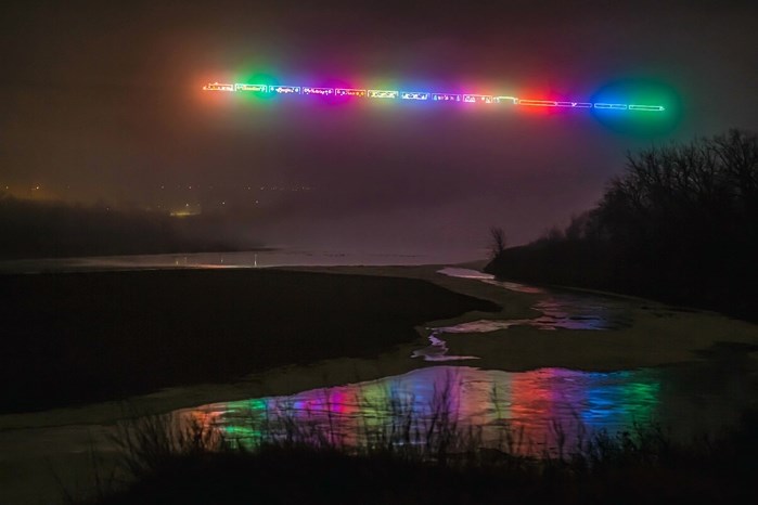 The CP Holiday Train appears to float in the fog as it travels across the iconic High Level Bridge in Lethbridge.