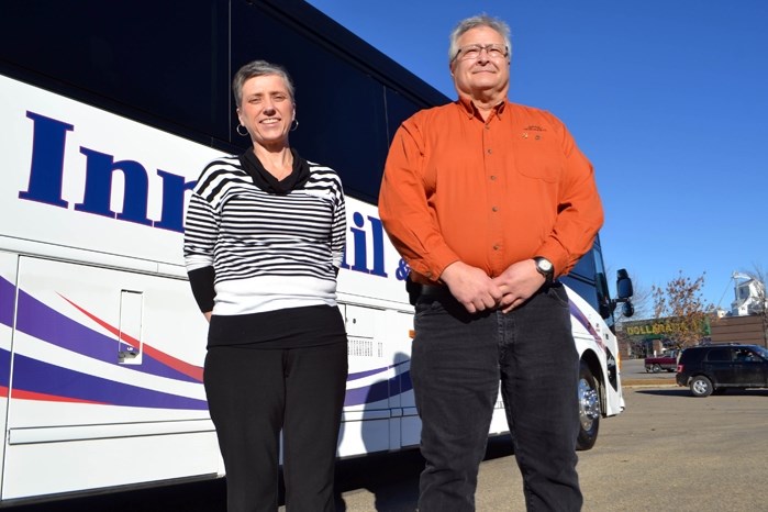 Karen Bradbury, the town&#8217;s community and social development coordinator, and Penhold&#8217;s Larry Kowalchuk, the driver of the Community Bus, a 47-seat vehicle that is 