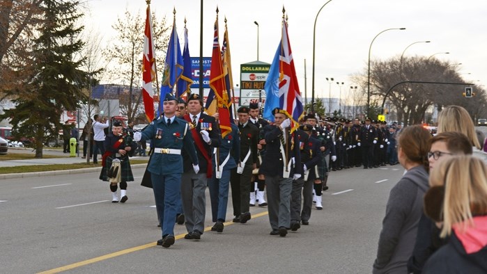 The Innisfail Royal Canadian Legion colour party lead the Remembrance Day parade downtown during the Remembrance Day Memorial Service Nov. 11