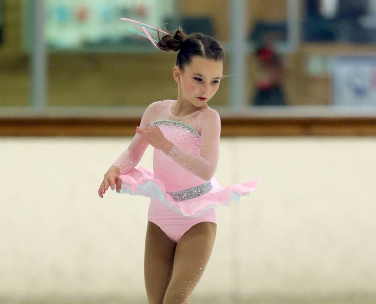 Nine-year-old Georgia Stevens is seen here performing an Axel jump during a recent competition.