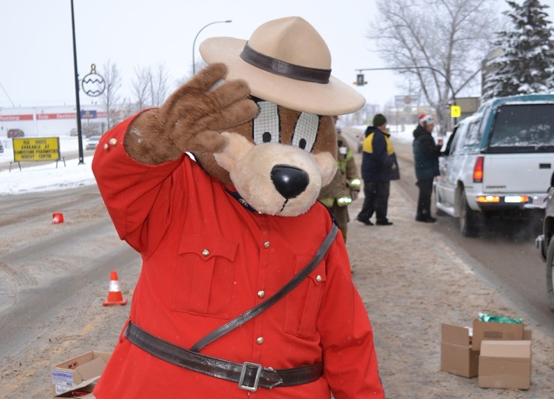 Safety Bear at last year&#8217;s 20th annual Charity Check Stop. The famed RCMP mascot will once again be handing out candy canes at this year&#8217;s fundraiser.