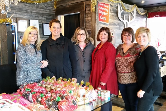 Kerry Towle, far right, and her team of volunteers preparing their Baskets of Hope on Dec. 4 at Sylvan Lake&#8217;s Bukwildz restaurant, the sponsors of this year&#8217;s