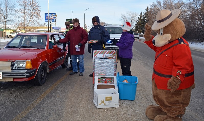 Innisfail and area residents donated food, toys, cash and clothing to the 21st annual Charity Checkstop in Innisfail on Dec. 17. More than a dozen volunteers from local