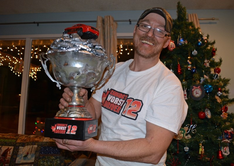 Tyler Dupont, the most improved driver and final graduate on Season 12 of Canada&#8217;s Worst Driver, proudly shows off his prized trophy.