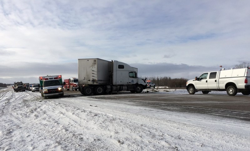 The semi trailer truck involved in the three-vehicle crash on the Queen Elizabeth II Highway on Jan. 31 was pulled to the side of the highway as it was blocking traffic and