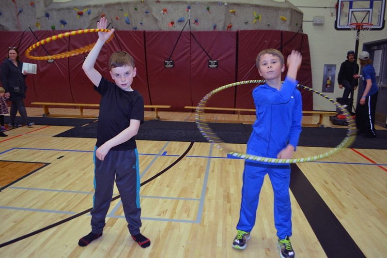 Jack Butts, 10, left, and 10-year-old Wade Mountain have some good old- fashioned kid fun during the Spring Registration night on March 7.