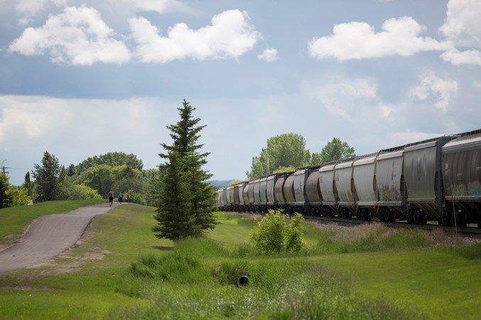  A train passes by the area where children cross the tracks on their way to and from school on June 25.