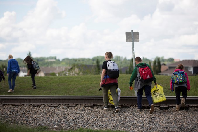  Children cross an unregulated portion of railway track at a spot known as White Rock Crossing.