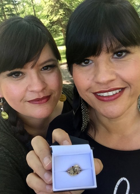  Kimberly Wickens, left, and twin sister Kelley Arnold hold family ring found on May 31 by Red Deer Regional Health Foundation staff after being missing since the death of their mother Velma Wickens-Vandendungen on Dec. 18, 2010.